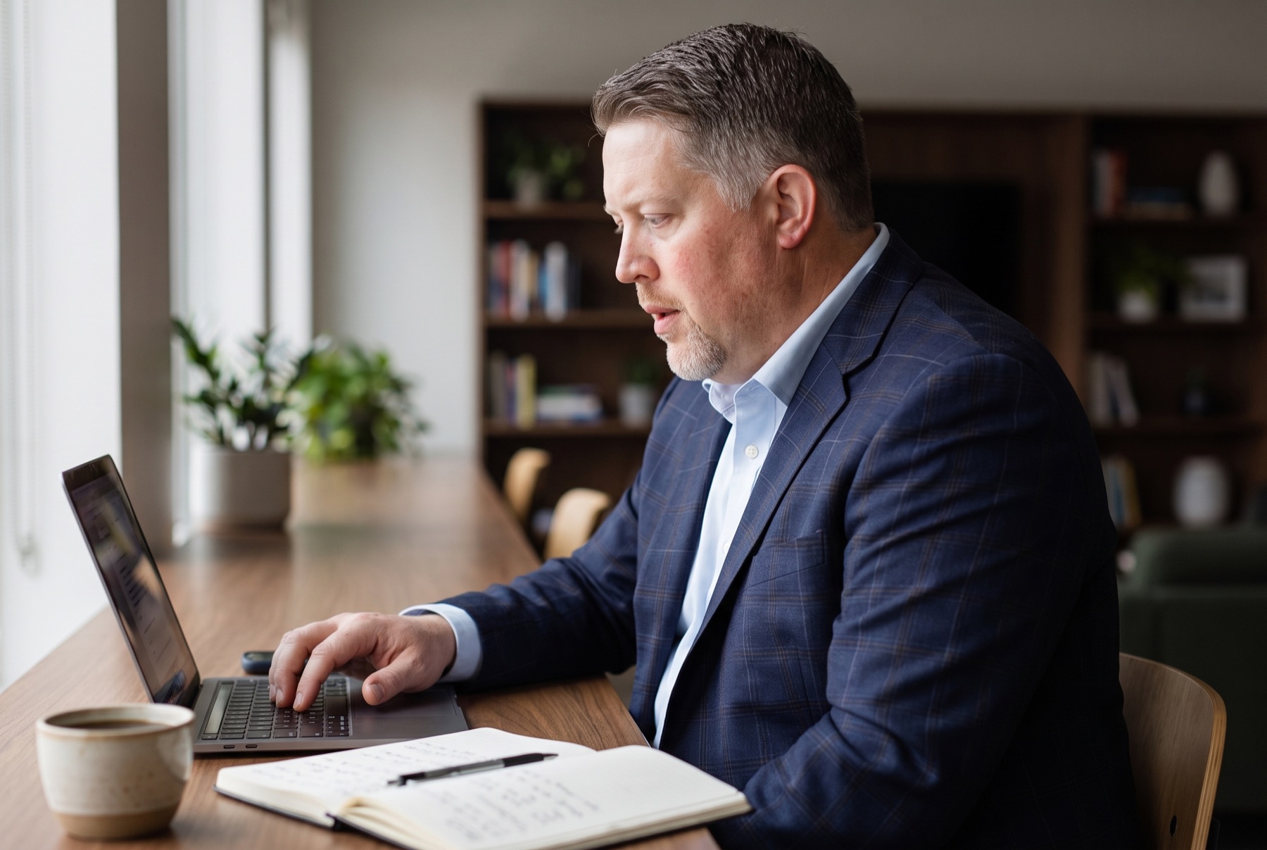 Andrew Kokes at work in his office